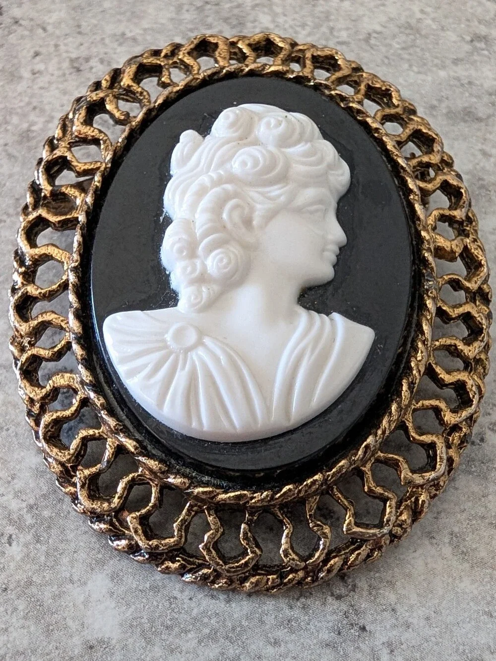 Classic Black and White Cameo Brooch with Gold Frame
